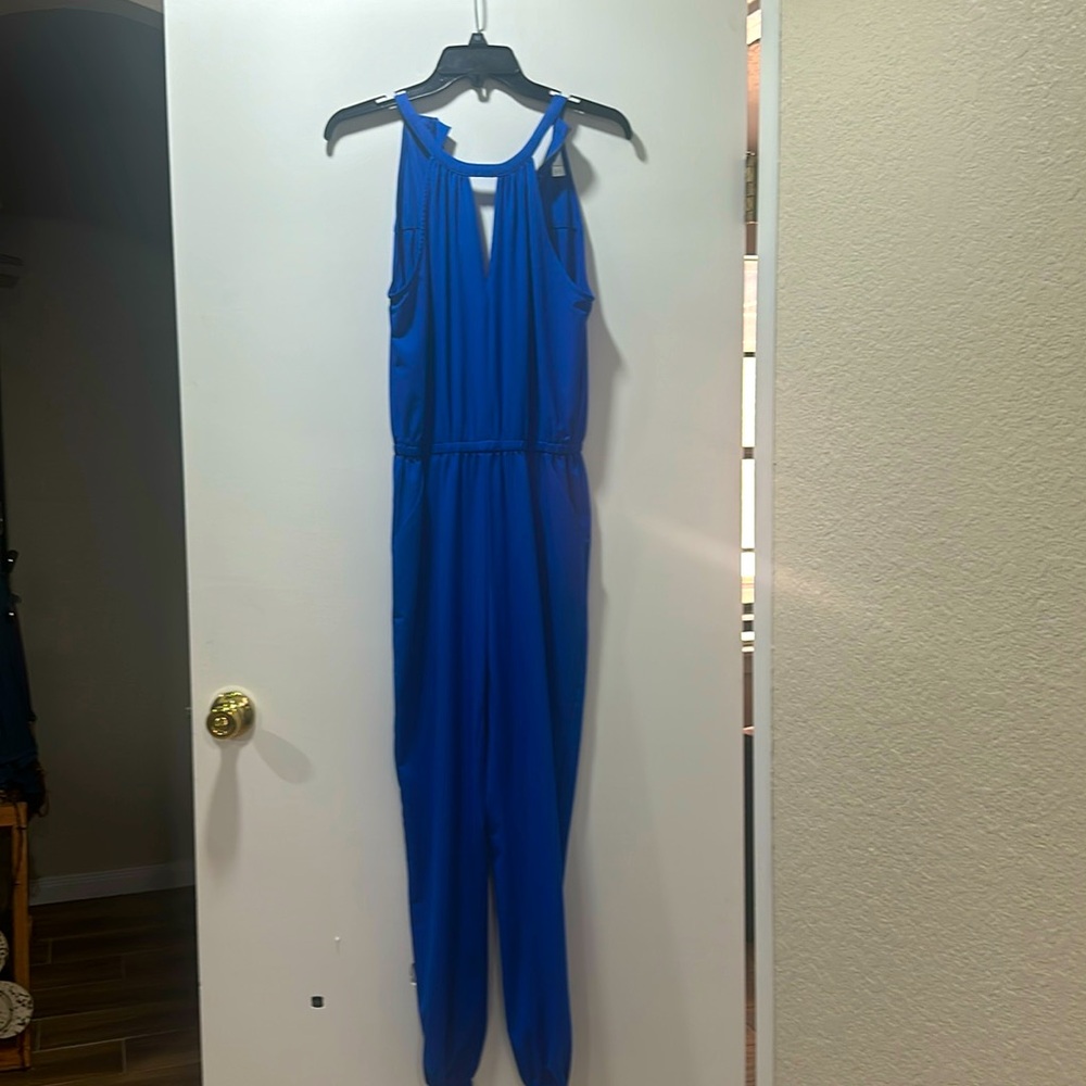 Blue sleeveless jumpsuit.